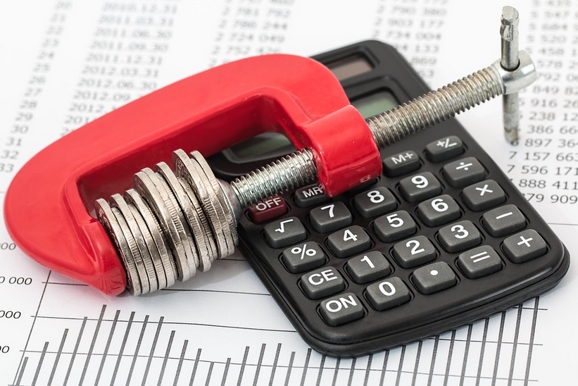 stacked pennies and a calculator
